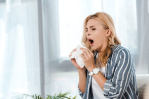 Sneezing from allergens in home indoor air