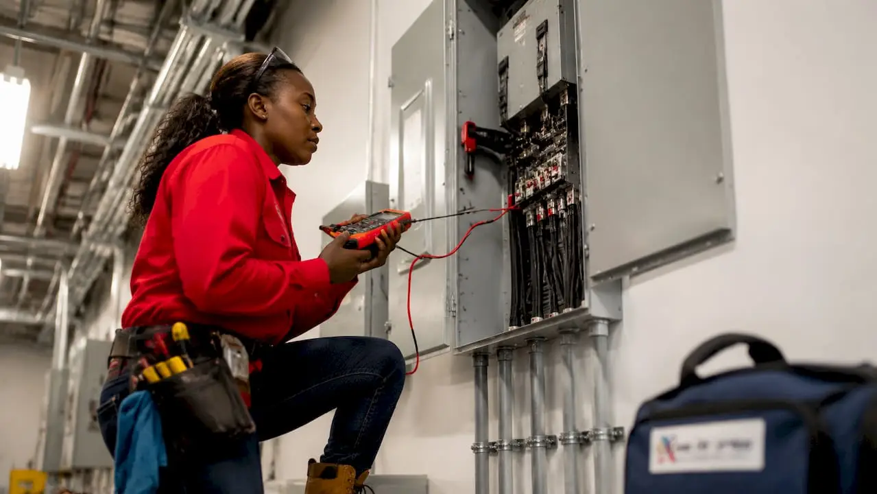 Electrician inspecting commercial main disconnect switch