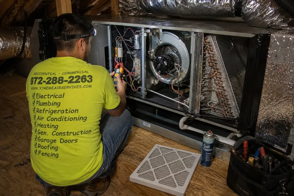 When maintenance isn't the right call, Sunnyvale, TX Xtreme Air Services technician testing the blower, capacitor and coil of a horizontal attic furnace during HVAC maintenance, Sunnyvale, TX